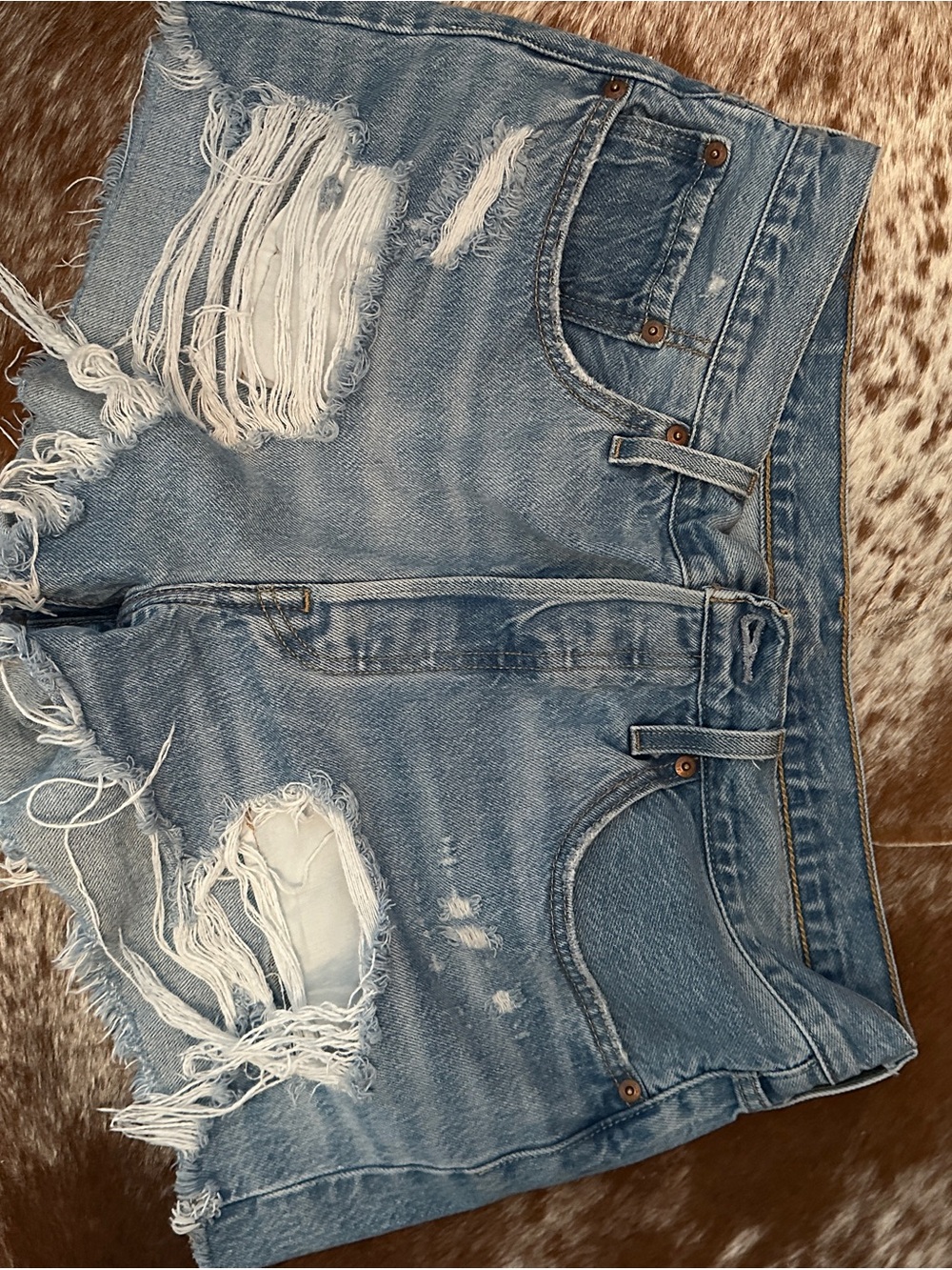 Levi’s Distressed Light Blue Denim Cutoff Shorts